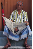 Man reading newspaper