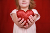 Child holding heart