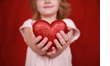 Child holding heart